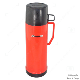 Descubre el encanto atemporal de este termo retro rojo con una taza de beber negra