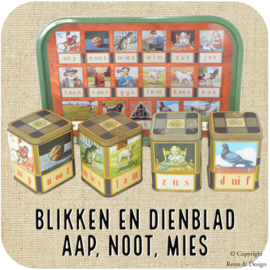 Nostalgische vintage set blikken en dienblad met afbeeldingen van het Iconische "Aap, Noot, Mies" Leesplankje!