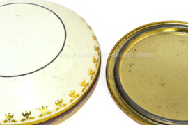 Round vintage tin with flowers on lid