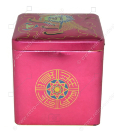 Vintage tin cube for tea by Van Nelle with an image of an Oriental lion or Chinese dragon