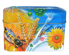 ​Orange and blue tin box for Wasa Crackers with images of a rooster, bee, sunflower, grain and fruit