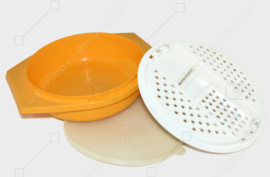 Vintage Tupperware slicing bowl in yellow with white grater and transparent lid