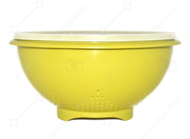 Green coloured vintage Tupperware colander with a white transparent grid