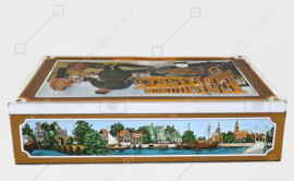 Vintage tin for Enkhuizer banquet with images of a harbour with fishing boats and regional costumes "Marken"