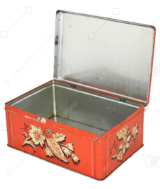 Vintage rectangular tin with a stylized floral pattern with leaf