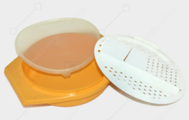 Tazón para cortar Tupperware vintage en amarillo con rallador blanco y tapa transparente