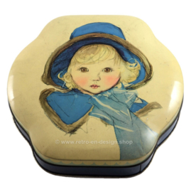 Brocante de lata de Côte d'Or, niña con sombrero azul