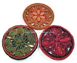 Set of three vintage raffia/wicker trivets in various colours, 60s and 70s