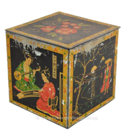 Vintage tea tin in cube shape with oriental images