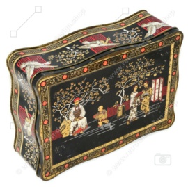 Vintage tea tin in black, gold and red with oriental images