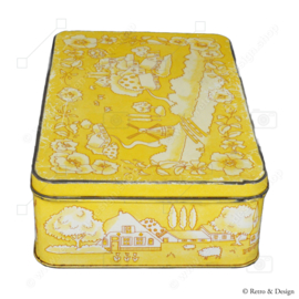 Yellow biscuit tin by Verkade with a decor of a drawn Dutch landscape