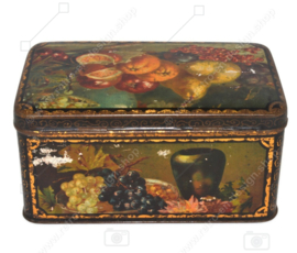 Vintage candy or cookie tin with still lifes of fruit pieces on all sides