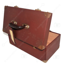 Tough brocante small cabin or travel suitcase with iron fittings and bakelite handle with label