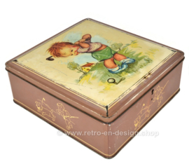 Vintage candy tin, storage tin or tin drum made by Van Melle with a drawing of a golfing boy