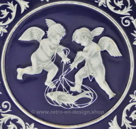 Round blue and white biscuit tin with cherubs, chubby child figure with wings