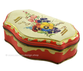 Red vintage tea tin by the Gruyter with spring or summer bouquet