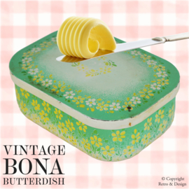 Experience the timeless charm of this vintage butter dish made by Bona!