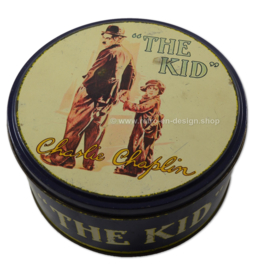 Vintage round tin drum with image of Charlie Chaplin "The Kid"