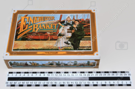 Vintage tin for Enkhuizer banquet with images of a harbour with fishing boats and regional costumes "Volendam"