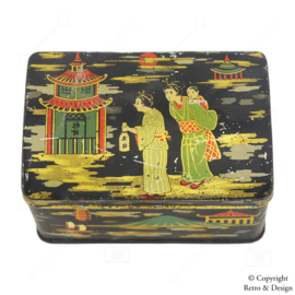 Boîte en métal japonaise vintage avec des images emblématiques d'un homme et d'une femme, du Mont Fuji, des pagodes et plus encore