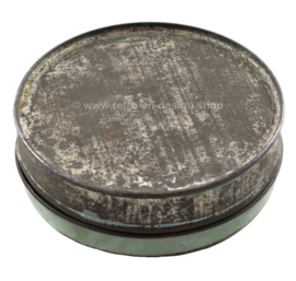 Round vintage candy tin with stylized birds