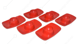 Set of six vintage egg cups in red with peel edge