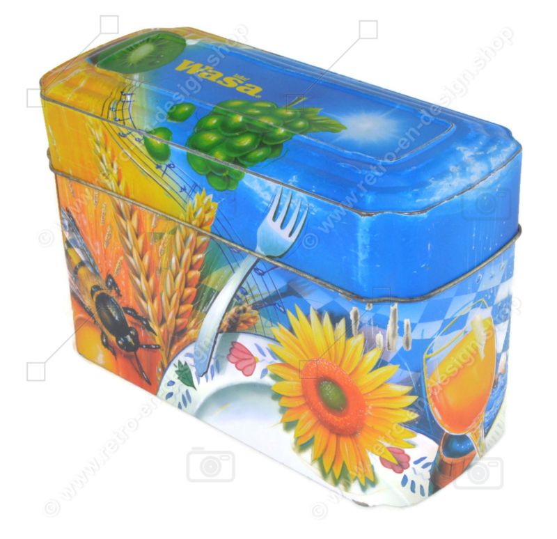 Orange mit blauer Blechdose für Crackers von Wasa mit einem Bild von Hahn, Biene, Sonnenblume, Getreide und Früchten