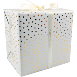 wit inpakpapier met gouden dots