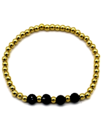 Elastieke Armband van stainless steel kralen en 4 zwarte glas kralen.