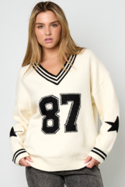 Sportieve trui, V hals. Crème - zwart. Maat L/XL