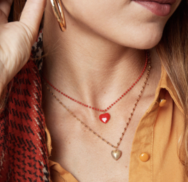 Stainless steel ketting, bolle hart bedel met reliëf. Goud.