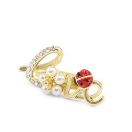 Kleine broche “love”. Goudkleurig + strass + parel