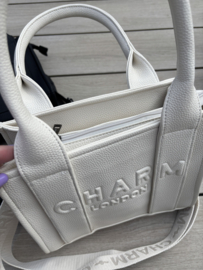 Kleine tas van Charm. Crème  imitatie leer