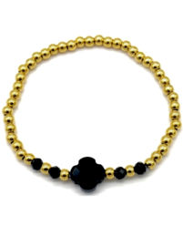 Elastieke Armband van stainless steel kralen en 5 zwarte glas kralen.