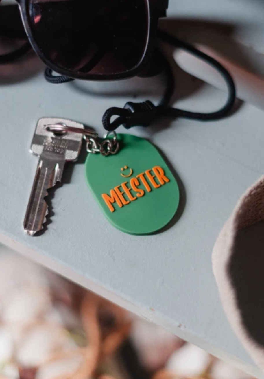 Sleutelhanger MEESTER. Groen-oranje