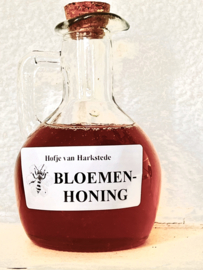 Bloemenhoning in schenkflesje