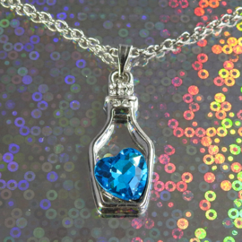 Blauw hart in flesje met ketting