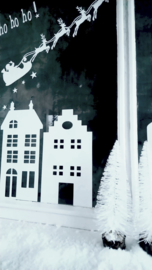 Raamsticker - Huisjes en kerstman in slee