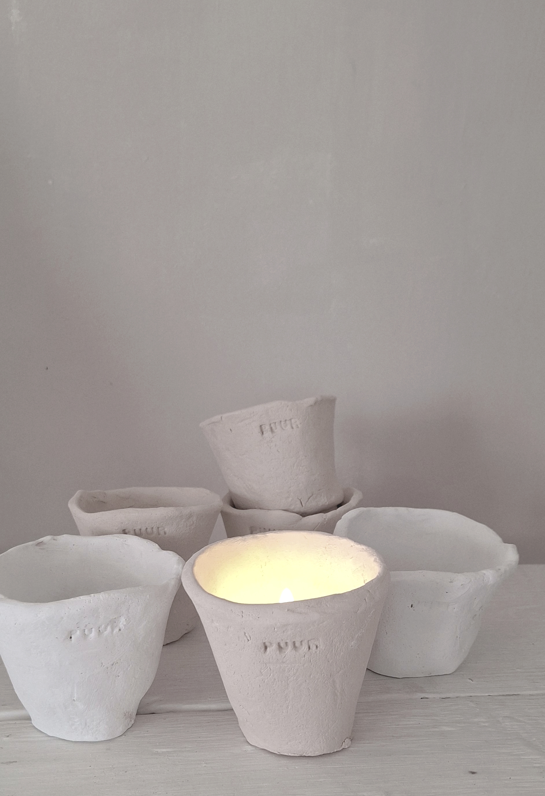 Steingutbecher Licht