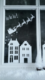 Raamsticker - Huisjes en kerstman in slee