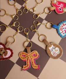 All The Luck In The World -Sleutelhanger met Kraaltjes - Strik