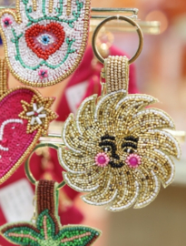 All The Luck In The World - Sleutelhanger Met Kraaltjes Lachende Zon