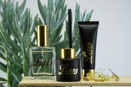 Zwart parfumflesje cylinder - gouden dopje