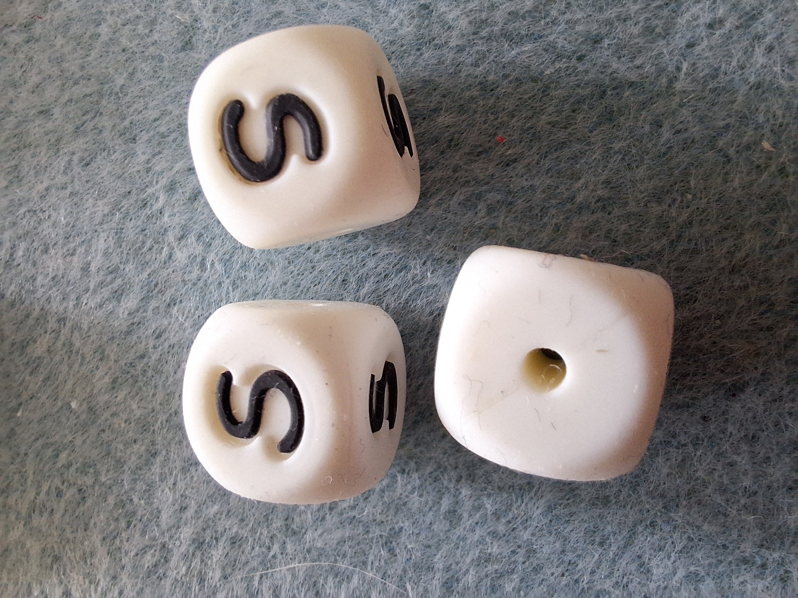 De letter S