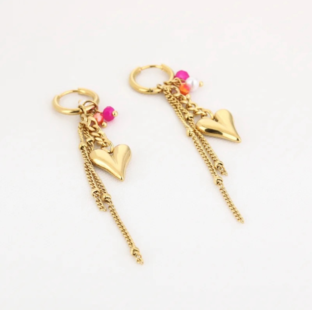 Oorbellen hartjes roze kralen