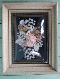 Lijst met bol glas en kunstbloemen