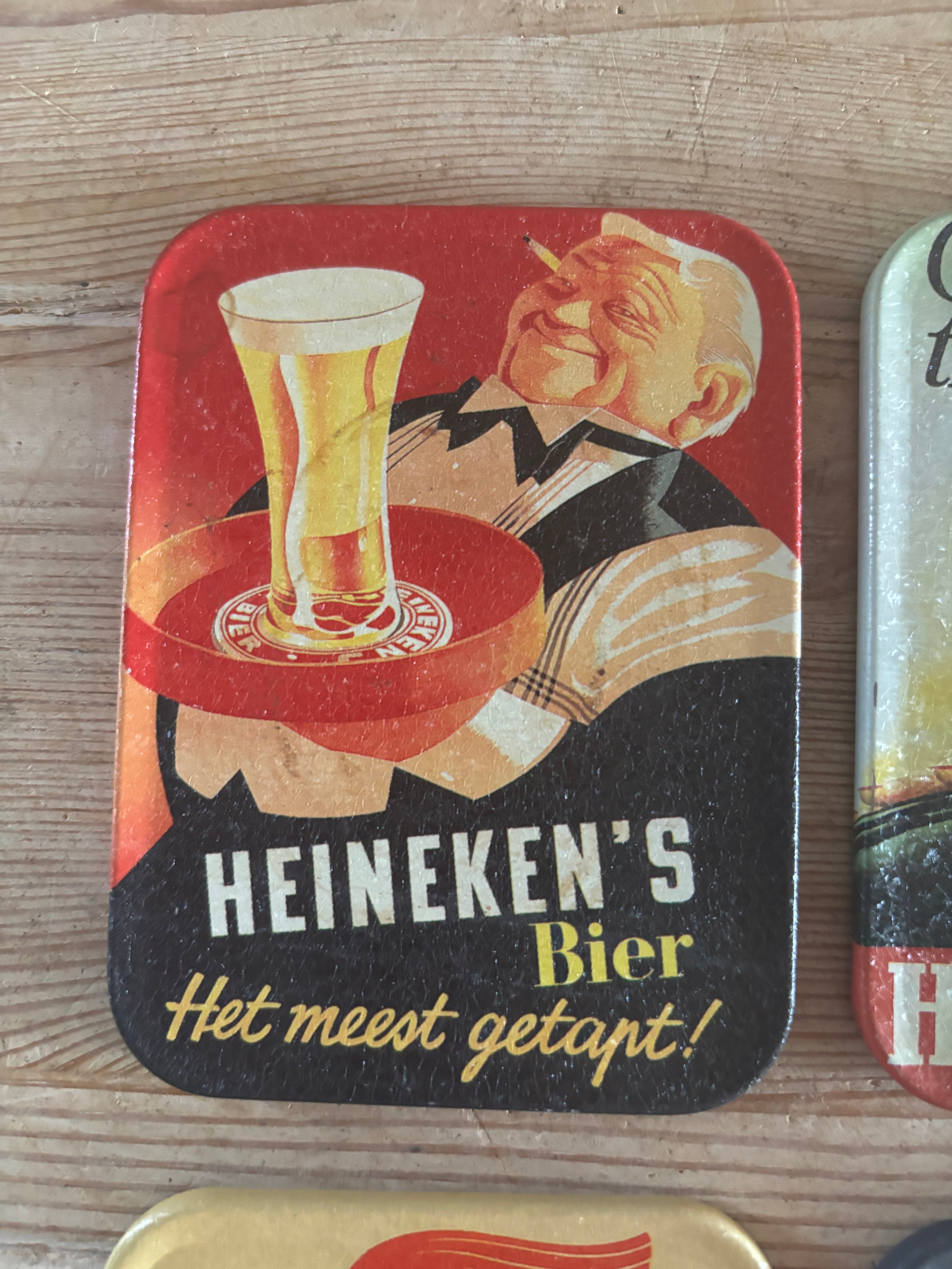(Verkocht)Heineken oude onderzetters blik