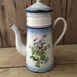 Blauwe koffiepot met bloemen