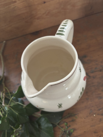Bollige kan met bloemdecor
