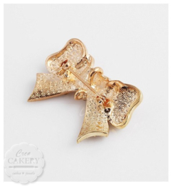 Sleutelhanger & broche met strik